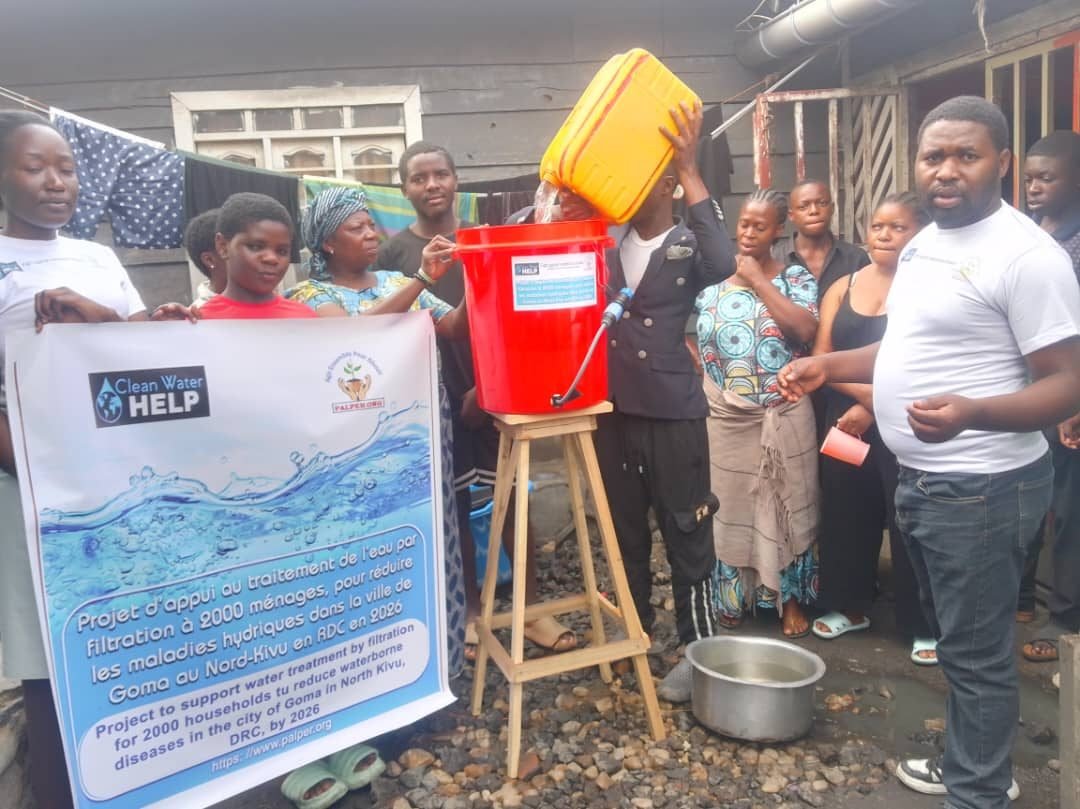 Water poured into a shared household filter at a handover in Goma, DR Congo
