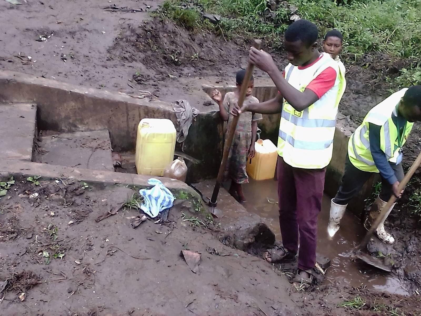 PALPER staff at a spring box with community members in North Kivu, DR Congo