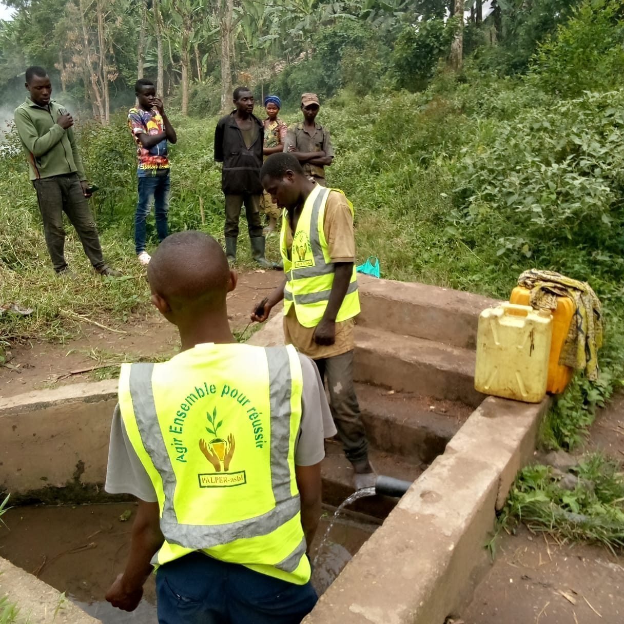 A PALPER staff member at a spring catchment in North Kivu, DR Congo
