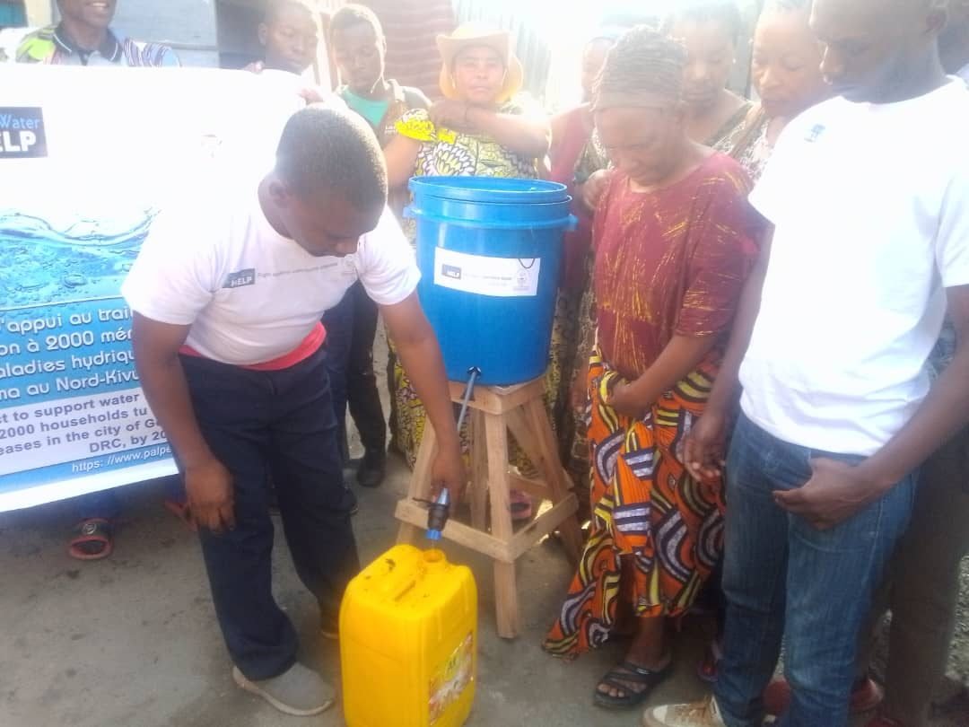 A PALPER team member demonstrating a household filter in Goma, DR Congo